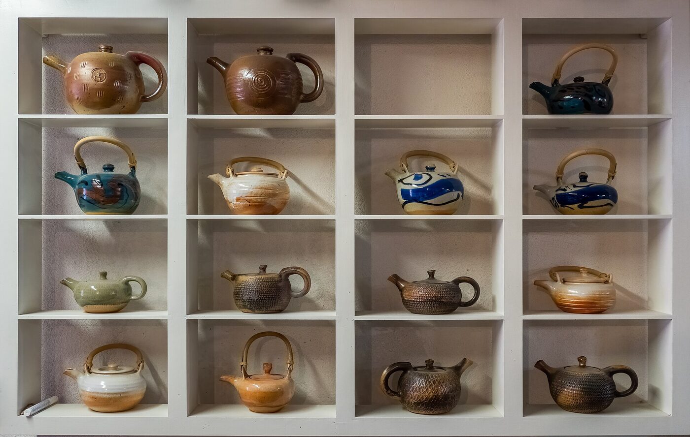 Handmade ceramics lined up on a shelf